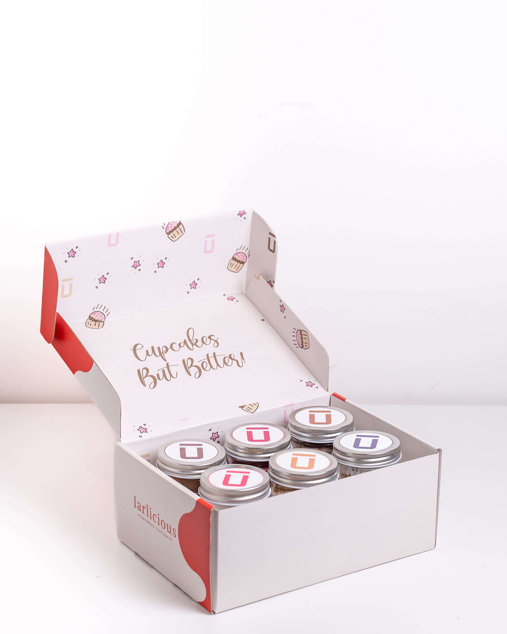 6 Pack Customizable Cupcake Delivery Australia in a beautifully designed box with six individual cupcake jars.