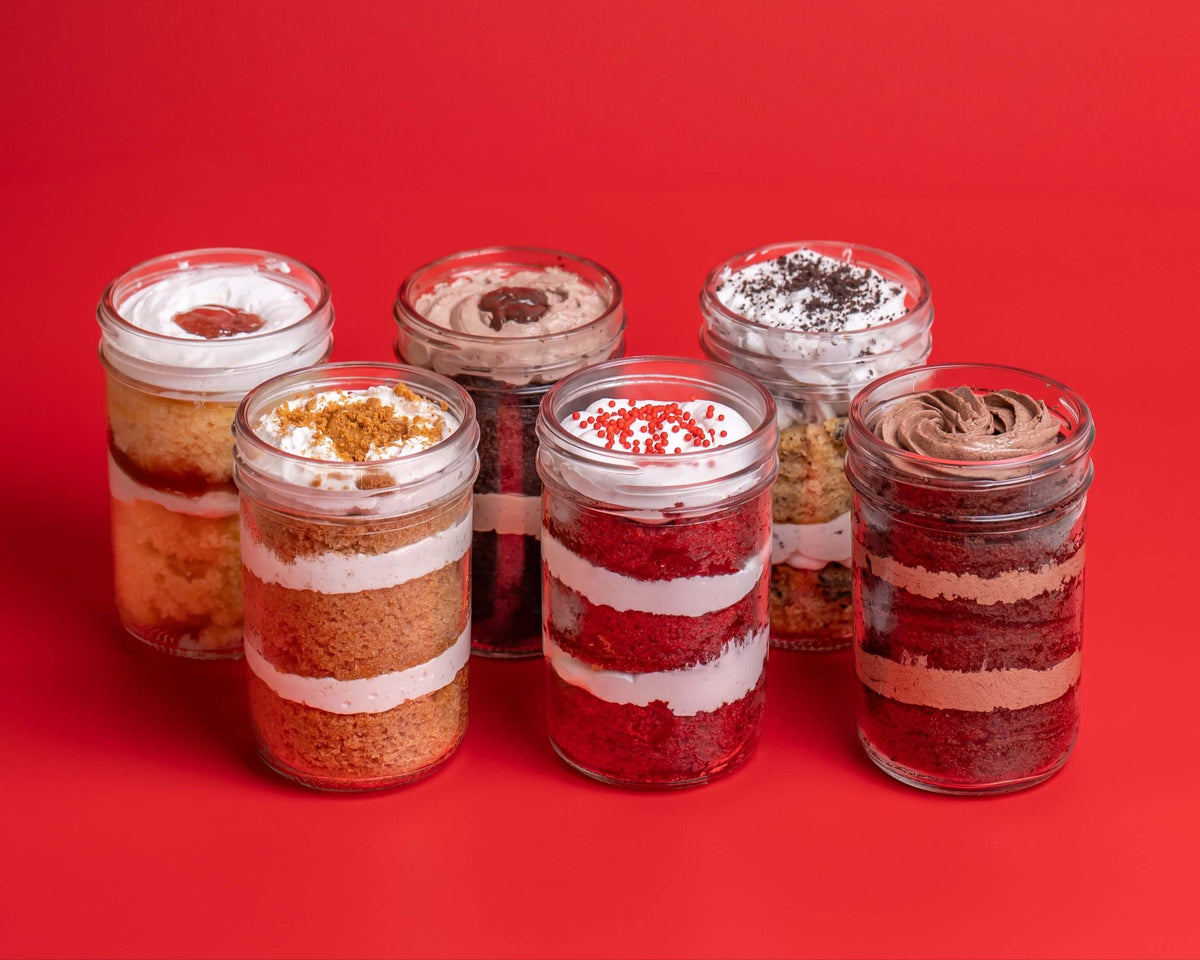 6 Pack Cupcake Delivery Australia - customizable jars filled with layered cake and toppings.